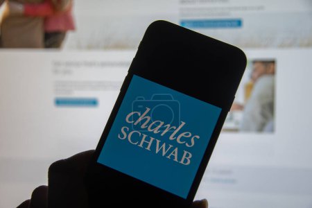 Photo for Rheinbach, Germany  5 December 2022,  The brand logo of the US company "Charles Schwab" on the display of a smartphone (focus on the brand logo) - Royalty Free Image