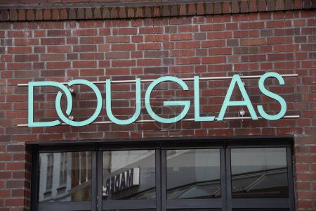 Photo for Husum, Germany  14 May 2023,  The brand logo of the perfumery chain "Douglas" in front of a branch in Husum - Royalty Free Image