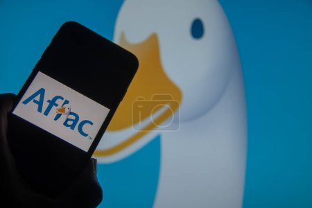 Photo for Rheinbach, Germany  13 March 2024,  The brand logo of the American insurance company "Aflac" on the display of a smartphone (focus on the brand logo) - Royalty Free Image