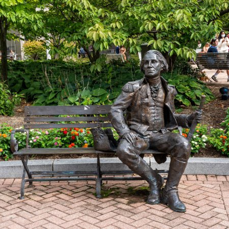 Washington, DC - Sept. 8, 2022: Sculpture titled George Washington Bench, by Gary Lee Price, sits in Kogan Plaza on the George Washington University Foggy Bottom campus.