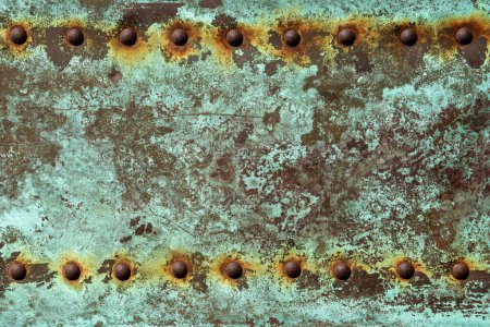 Photo for Green verdegris background with rusted rivets - Royalty Free Image