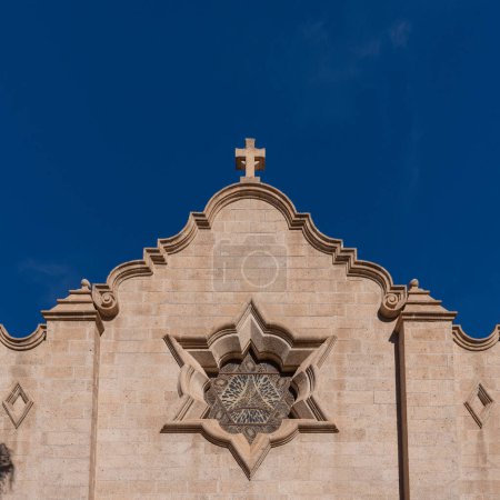 Photo for Phoenix, AZ - Nov. 11, 2022: Trinity Episcopal Cathedral's rose window consists of triangles symbolizing the Trinity, and the two triangles form the Star of David, implying the origins of Christianity - Royalty Free Image
