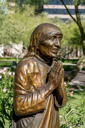 Photo for Phoenix, AZ - Nov. 12, 2022: This bronze statue of Saint Teresa of Calcutta by Michael Myers is at Virginia Piper Plaza outside St. Mary's Roman Catholic Basilica. - Royalty Free Image