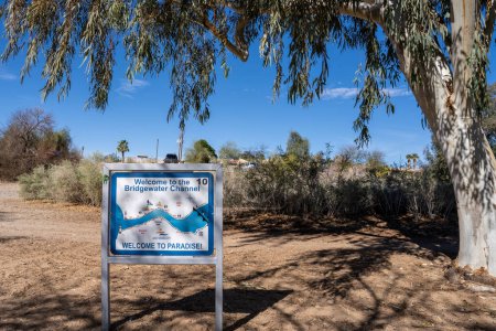 Photo for Lake Havasu City, AZ - March 10, 2023: Welcome to Bridgewater Channel, Welcome to Paradise sign is posted on Shoreline Trail - Royalty Free Image