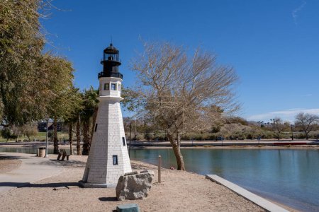 Photo for Lake Havasu City, AZ - March 10, 2023: This one quarter size replica of The Main Buffalo Light at the Erie Canal, created by the Lake Havasu Lighthouse Club, sits along Bridgewater Channel. - Royalty Free Image