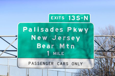 Photo for Sign on I-287 I-87 NY State Thruway in Nanuet, New York for Exit 13 S-N for Palisades Parkway New Jersey and Bear Mountain - Royalty Free Image