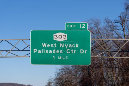 Photo for Sign on I-287 I-87 NY State Thruway in West Nyack, New York for Exit 12 for NY-303 Palisades Center Drive and West Nyack - Royalty Free Image