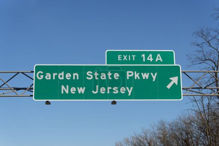 Photo for Sign on I-287 I-87 Governor Thomas E. Dewey Thruway in Chestnut Ridge, New York for Exit 14A to the Garden State Parkway in New Jersey - Royalty Free Image