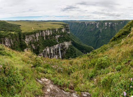 canyon of itaimbezinho serra geral seen from above in day with many clouds - Brazil