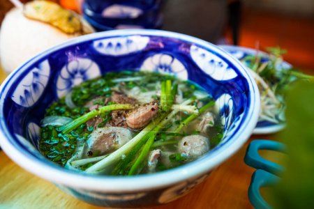 Photo for Pho Bo Nam Bo at Thien Ly Restaurant Da Nang, Vietnam. Pho is a bowl of Vietnamese noodle soup consisting of broth to be stewed for 5 hours with cinnamon & bone, noodles, onion, cilantro and meat. - Royalty Free Image
