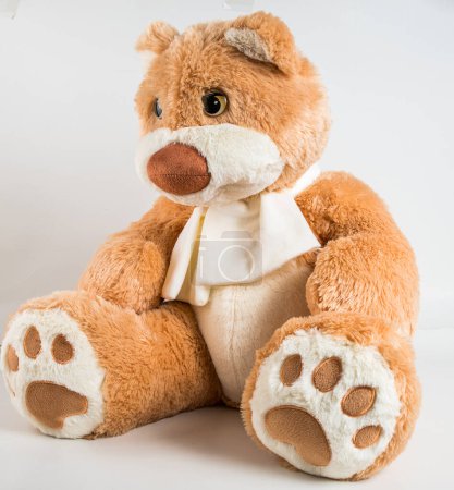 Photo for Teddy bear with a bow on a white background. Soft children's toy. - Royalty Free Image