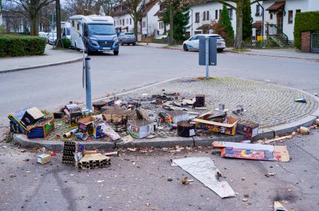 Photo for Berlin, Germany - January 1, 2023: Various remains of a New Year's Eve celebration along a street. - Royalty Free Image