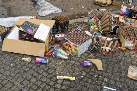 Photo for Berlin, Germany - January 1, 2023: Remains of a New Year's Eve celebration along a street. - Royalty Free Image