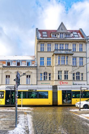 Photo for Berlin, Germany - January 19, 2024: Street scene in Berlin-Koepenick with a streetcar in front of historic buildings. - Royalty Free Image