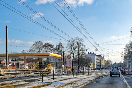 Photo for Berlin, Germany - January 19, 2024: Main street in Berlin with a construction site, a gas station and streetcar tracks in the middle of the roadway. - Royalty Free Image