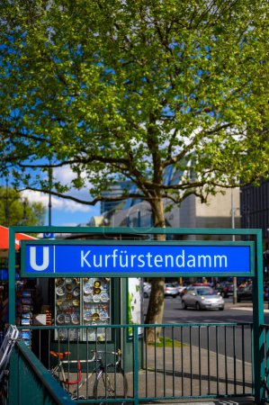 Kurfuerstendamm subway station in the center of Berlin with a souvenir store and the boulevard in the background.