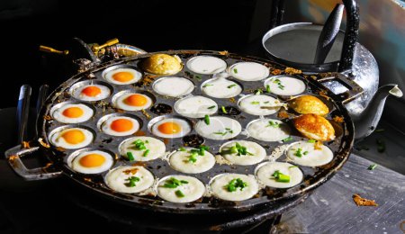 Photo for Thai street food in Chiang Mai with fried eggs and coconut pudding pancakes - Royalty Free Image