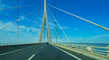 Photo for View on modern cable-stayed road bridge over river Seine against blue sky (pont de normandie, France) - Royalty Free Image