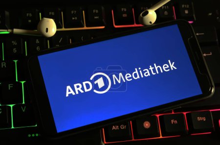 Photo for Viersen, Germany - December 9. 2023: Closeup of smartphone on computer keyboard with logo lettering of german ARD TV channel mediathek - Royalty Free Image