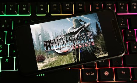 Photo for Viersen, Germany - January 9. 2024: Closeup of smartphone on pc keyboard with logo lettering of Final Fantasy 7 Rebirth - Royalty Free Image