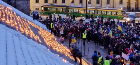 Photo for Helsinki, Finland - February 24, 2023: Candles at the Light will win over darkness event where candles were lit for honouring the victims of Russian aggression and showing support for Ukraine at the Senate Square in downtown Helsinki. - Royalty Free Image