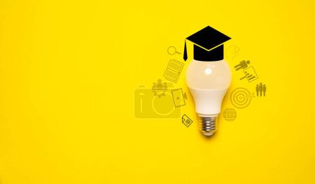 Photo for Lightbulb with graduate hat and education icon on yellow background for success study and learning concept. - Royalty Free Image
