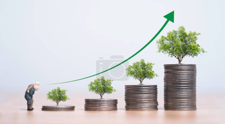 Couple of old man and woman standing with coins stacking and growing trees for money saving to get interest and dividend from investment, retirement concept.