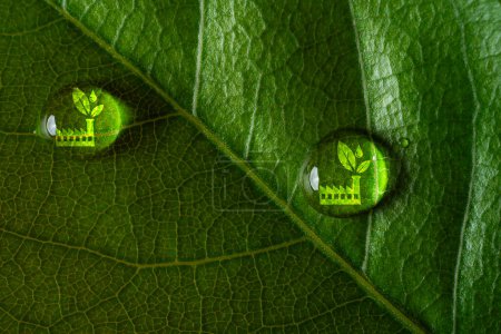 Icono de fábrica verde dentro de gotita en hoja verde para una fabricación limpia y economía para reducir las emisiones de dióxido de carbono del protocolo de Kyoto en 2050, concepto de sostenibilidad ambiental.