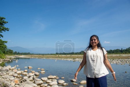 a teenage girl enjoying the view of Murti river valley