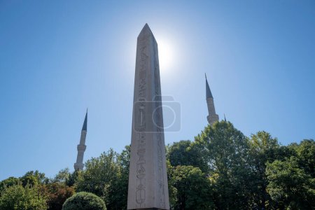 Photo for Back lit theodosius obelisk in Istanbul with two minarets of the blue mosque in the background, horizontal - Royalty Free Image