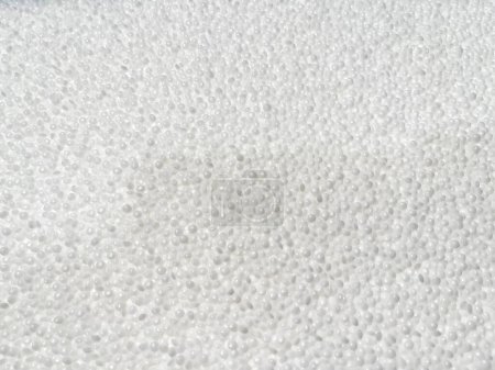 Photo for Texture of white pellets, production of plastic parts, plastic injection, a bunch of plastic pelets, plastic grains, white background of white granules, white cork, horizontal - Royalty Free Image