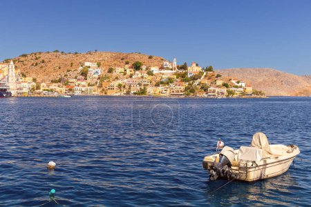 Photo for View of old traditional fishing boats in the harbor of Sumi village on a sunny day. Greece. Dodecanese. - Royalty Free Image
