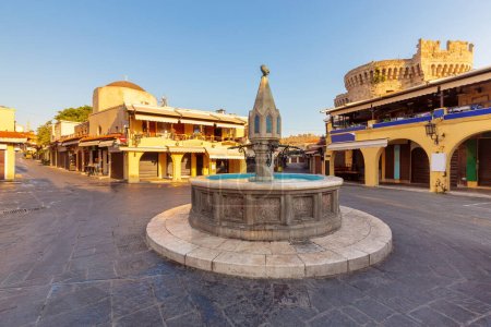 Photo for View of Hippocrates Square and the famous Sintrivan fountain in Rhodes at dawn. Greece. - Royalty Free Image