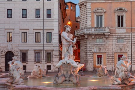 View of the famous ancient fountain with newts in the early morning at blue hour. Rome. Italy.