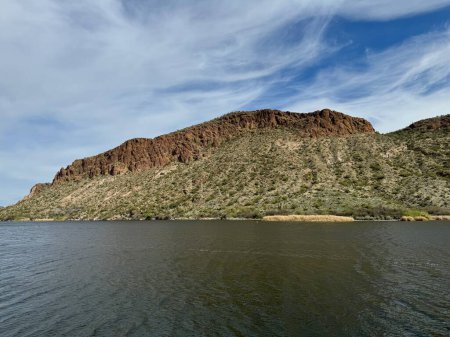 View from a steamboat, of Canyon Lake reservoir and rock formations in Maricopa County, Arizona in the Superstition Wilderness of Tonto National Forest near Apache Trail.  The lake was formed by damming the Salt River as part of Salt River Project.