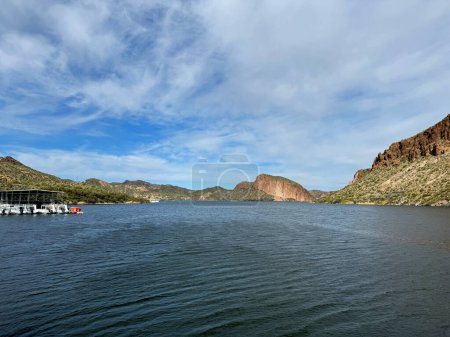 View from a steamboat, of Canyon Lake reservoir, harbor and rock formations in Maricopa County, AZ in the Superstition Wilderness of Tonto National Forest near Apache Trail. The lake was formed by damming the Salt River as part of Salt River Project.