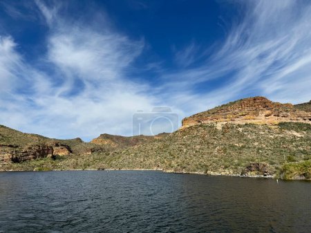 Photo for View from a steamboat, of Canyon Lake reservoir and rock formations in Maricopa County, Arizona in the Superstition Wilderness of Tonto National Forest near Apache Trail.  The lake was formed by damming the Salt River as part of Salt River Project. - Royalty Free Image