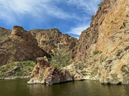 Photo for View from a steamboat, of Canyon Lake reservoir and rock formations in Maricopa County, Arizona in the Superstition Wilderness of Tonto National Forest near Apache Trail. The lake was formed by damming the Salt River as part of Salt River Project. - Royalty Free Image