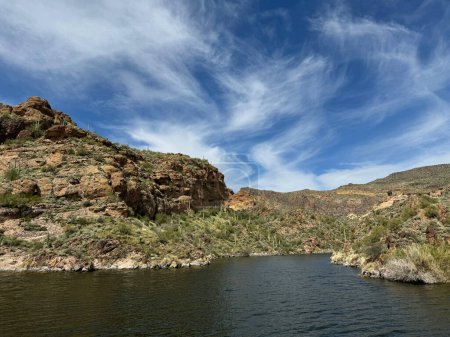 Photo for View from a steamboat, of Canyon Lake reservoir and rock formations in Maricopa County, Arizona in the Superstition Wilderness of Tonto National Forest near Apache Trail. The lake was formed by damming the Salt River as part of Salt River Project. - Royalty Free Image