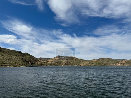 View from a steamboat, of Canyon Lake reservoir and rock formations in Maricopa County, Arizona in the Superstition Wilderness of Tonto National Forest near Apache Trail. The lake was formed by damming the Salt River as part of Salt River Project.