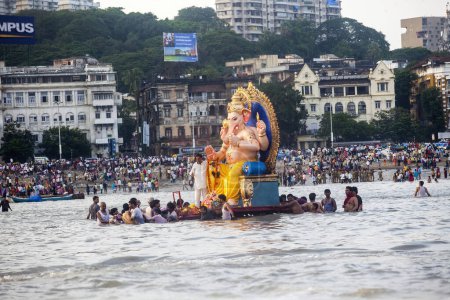 Photo for India, Maharashtra, Mumbai, September 09, 2010: A huge idol of Lord Ganesh being immersed at Girgaum Chowpatty in the Arabian Sea. - Royalty Free Image