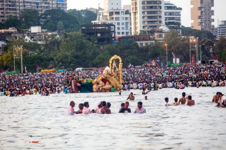 Photo for India, Maharashtra, Mumbai, September 09, 2010: Huge idols of Lord Ganesh being immersed at Girgaum Chowpatty in the Arabian Sea. - Royalty Free Image