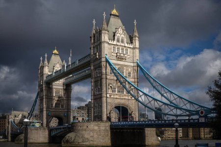 Photo for Tower Bridge in London viewed from the South Quay next to the River Thames right after an autumn rain shower - Royalty Free Image