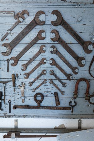 Photo for Old shed containing rusty mechanical tools. Vintage old tools with rust - Royalty Free Image