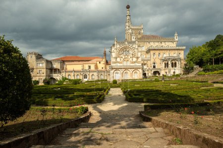 Photo for Luso, Portugal - 22 September 2020: Bussaco Palace Hotel and surrounding garden. Built in XIX century, neomanueline style it is a portuguese national monument - Royalty Free Image