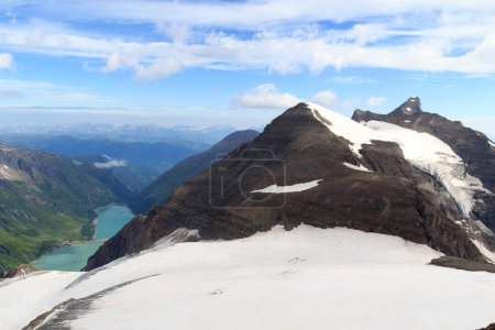 Photo for Mountain snow and glacier panorama with summit Klockerin and Grosses Wiesbachhorn and reservoir Wasserfallboden and Mooserboden in Glockner Group, Austria - Royalty Free Image