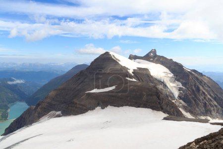 Photo for Mountain snow and glacier panorama with summit Klockerin and Grosses Wiesbachhorn and reservoir Wasserfallboden and Mooserboden in Glockner Group, Austria - Royalty Free Image