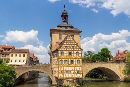 Old town hall with bell tower and bridges over river Regnitz in Bamberg, Upper Franconia, Bavaria, Germany
