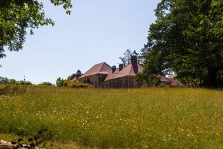 Old palace with meadow in park at Hermitage (Eremitage) Museum in Bayreuth, Bavaria, Germany