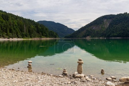 Lake Sylvenstein Reservoir, cairns and mountain alps panorama in Bavaria, Germany